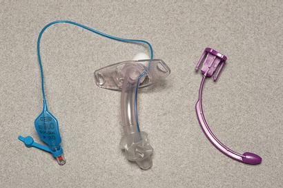 Portex® Blue Line Ultra® tracheostomy tube shown with introducer.