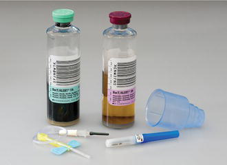 A vacuumed collection system: two blood culture bottles, a Vacutainer holder and a Vacutainer ‘butterfly’.